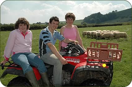 Rachel and Will Gittoes and their mum Mary with pedigree Beltex females in-the Gweynffrwyd flock.