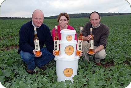 From this to this - left to right, Colin McGregor, Louise Nixon and John Baker Cresswell in an oilseed rape crop with Borderfields' culinary oil and birdseed.