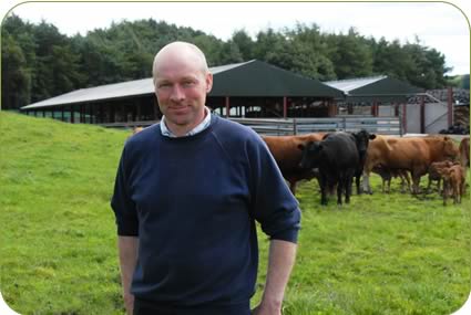 Brian Atkinson with the extended cattle housing