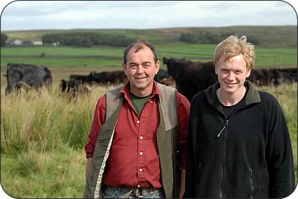 Tom Robinson, left, with son Philip and Galloway cows and calves on the white hill at Ottercops