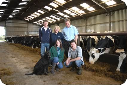 Left to right, back, Greg, Gillian and Peter Graham, with, front, Labrador Max, Dawn Cathers and Lee Graham with the milk cows at Anguswell. 