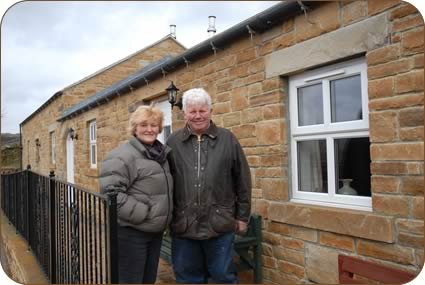 Jan and Harry Elliott outside the holiday cottages